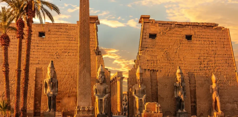 Luxor Temple entrance with obelisk and ancient statues in Luxor, Egypt